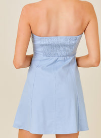 Back of aqua strappless mini dress