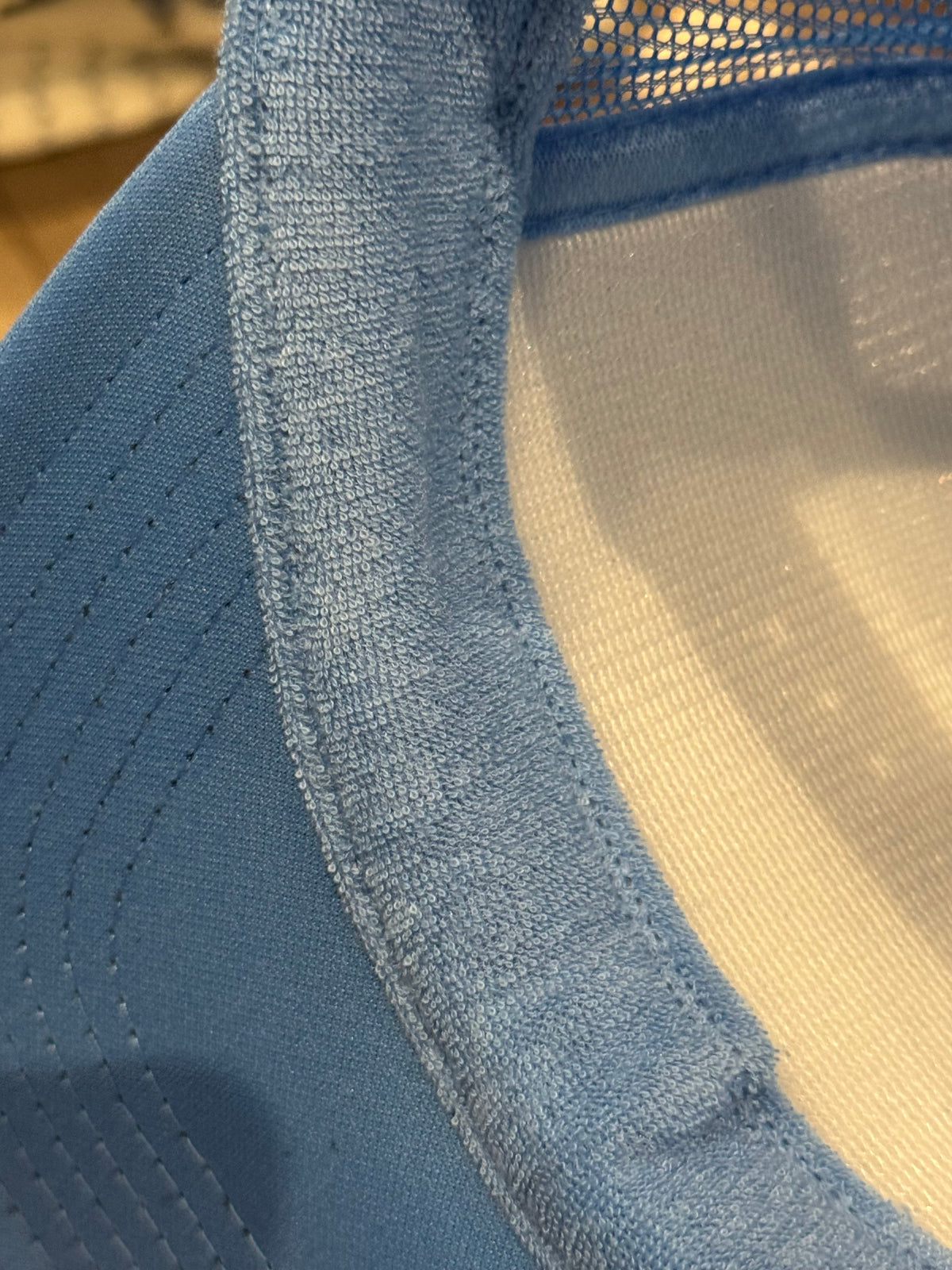 inside sweatband of light blue dallas pegasus hat